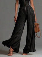Vittoria · Black chiffon jumpsuit with V-neck, sleeveless, zip, pleated, wide-leg pants